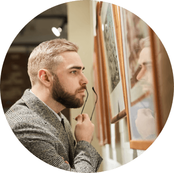 Visitor observing art in a museum